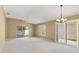 Spacious living room with abundant natural light and neutral carpeting at 2169 Smoaks St, The Villages, FL 32162