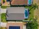 Aerial view of house, pool, and solar panels on neighboring house at 223 Knollwood Dr, Davenport, FL 33837