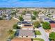 Aerial view of neighborhood, showing homes and solar panels at 223 Knollwood Dr, Davenport, FL 33837