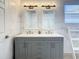 Double vanity bathroom with gray cabinets at 223 Knollwood Dr, Davenport, FL 33837