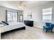 Bright bedroom with a queen-size bed and large window at 223 Knollwood Dr, Davenport, FL 33837