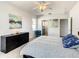 Bright bedroom with a queen bed and ceiling fan at 223 Knollwood Dr, Davenport, FL 33837