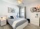 Bright bedroom with a full-size bed and window at 223 Knollwood Dr, Davenport, FL 33837