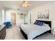 Bedroom with a queen bed, ceiling fan, and en-suite bath at 223 Knollwood Dr, Davenport, FL 33837