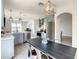 Farmhouse dining table with four chairs in kitchen area at 223 Knollwood Dr, Davenport, FL 33837