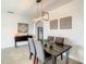 Elegant dining room featuring a dark wood table and statement lighting at 223 Knollwood Dr, Davenport, FL 33837