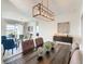 Spacious dining area with a wooden table and stylish decor at 223 Knollwood Dr, Davenport, FL 33837