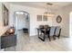 Bright dining room with a wooden table and view into the entryway at 223 Knollwood Dr, Davenport, FL 33837