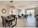 Modern dining room with a rustic table and access to the backyard at 223 Knollwood Dr, Davenport, FL 33837