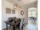 Modern farmhouse dining room with a wooden table and grey chairs at 223 Knollwood Dr, Davenport, FL 33837