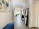 Bright and airy entryway with tile floors and a view of the living area at 223 Knollwood Dr, Davenport, FL 33837