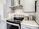 Modern kitchen with stainless steel appliances and white quartz countertops at 223 Knollwood Dr, Davenport, FL 33837