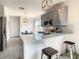 Modern kitchen with gray cabinets and breakfast bar at 223 Knollwood Dr, Davenport, FL 33837