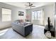 Cozy living room with gray sofa and pool view at 223 Knollwood Dr, Davenport, FL 33837