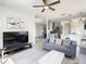 Living area with gray sofa and kitchen access at 223 Knollwood Dr, Davenport, FL 33837