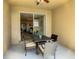 Relaxing patio with table and chairs, overlooking the backyard at 223 Knollwood Dr, Davenport, FL 33837