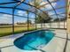 Relaxing screened pool with spa, offering a private oasis at 223 Knollwood Dr, Davenport, FL 33837