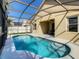 Enjoy this screened pool and spa, steps from the patio at 223 Knollwood Dr, Davenport, FL 33837
