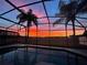 Sunset view from screened pool and lanai at 223 Knollwood Dr, Davenport, FL 33837