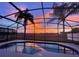 Sunset view from screened pool and lanai at 223 Knollwood Dr, Davenport, FL 33837