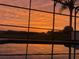 Sunset view from screened pool and lanai at 223 Knollwood Dr, Davenport, FL 33837