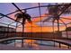 Sunset view from screened pool and lanai at 223 Knollwood Dr, Davenport, FL 33837