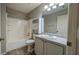 Bathroom showcasing a tub with shower, vanity, and updated fixtures at 3449 Roanoke St, The Villages, FL 32162