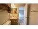 Bathroom vanity with a mirror showing a view of the bedroom at 3449 Roanoke St, The Villages, FL 32162
