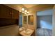 Bathroom vanity and mirror with a view of the bedroom at 3449 Roanoke St, The Villages, FL 32162