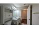 Bright bathroom featuring a vanity with storage and a mirrored cabinet at 3449 Roanoke St, The Villages, FL 32162