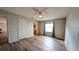 Bedroom featuring hardwood floors, ensuite access, and ample natural light at 3449 Roanoke St, The Villages, FL 32162