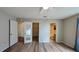 Bedroom with light-gray walls, wood-look floors, and white doors at 3449 Roanoke St, The Villages, FL 32162