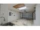 Spacious garage with sink and garage door at 3449 Roanoke St, The Villages, FL 32162