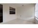 The property features a cozy sunroom with vinyl walls, a ceiling fan, and sliding windows with blinds at 3449 Roanoke St, The Villages, FL 32162