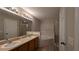 A spacious bathroom features a dual sink vanity, soaking tub, and glass enclosed shower at 3639 Bream Cir, Fruitland Park, FL 34731