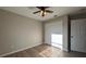 Bright bedroom with double door closet and wood-look floors at 3639 Bream Cir, Fruitland Park, FL 34731