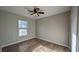 Bedroom features wood-look flooring, ceiling fan, and a window at 3639 Bream Cir, Fruitland Park, FL 34731