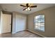 Spacious bedroom with double door closet and large window at 3639 Bream Cir, Fruitland Park, FL 34731
