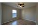 Bedroom with wood-look flooring, ceiling fan, and a window at 3639 Bream Cir, Fruitland Park, FL 34731
