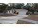One-story house with attached garage and driveway at 3639 Bream Cir, Fruitland Park, FL 34731
