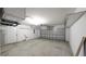 Spacious garage with overhead storage and large door at 3639 Bream Cir, Fruitland Park, FL 34731