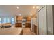 A kitchen features wooden cabinets, stainless steel appliances, wood floors, and white refrigerator at 3639 Bream Cir, Fruitland Park, FL 34731