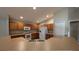 Kitchen with wood cabinets, white appliances, and a breakfast bar at 3639 Bream Cir, Fruitland Park, FL 34731