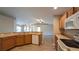 Open concept kitchen features a breakfast bar and stainless steel dishwasher at 3639 Bream Cir, Fruitland Park, FL 34731