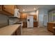 Kitchen with wood cabinets and white appliances at 3639 Bream Cir, Fruitland Park, FL 34731