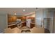 A bright kitchen features wooden cabinets, stainless steel appliances, and wood floors at 3639 Bream Cir, Fruitland Park, FL 34731