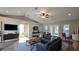 Modern living room featuring wood floors, neutral paint, and stylish furniture in an open layout at 3639 Bream Cir, Fruitland Park, FL 34731