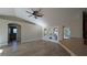Open living room with wood floors, neutral walls, and French doors leading to an outdoor area at 3639 Bream Cir, Fruitland Park, FL 34731
