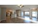 Spacious living room featuring wood floors and a ceiling fan, with an open layout to the kitchen at 3639 Bream Cir, Fruitland Park, FL 34731
