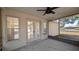Covered porch with French doors leading to interior at 3639 Bream Cir, Fruitland Park, FL 34731